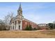 Unique building conversion with traditional architecture, brick facade, and steeple at 1200 Ponce De Leon Ne Ave # A1, Atlanta, GA 30306