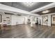 Large fitness room with wood-style floors, large mirrors, and fitness equipment at 1200 Ponce De Leon Ne Ave # A1, Atlanta, GA 30306