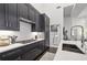 Chic kitchen with dark cabinets, white countertops, and stainless steel appliances at 1200 Ponce De Leon Ne Ave # A1, Atlanta, GA 30306