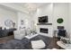 Stylish living room with fireplace, neutral decor, and high ceilings at 1200 Ponce De Leon Ne Ave # A1, Atlanta, GA 30306