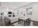 Bright open floor plan living and dining with dark wood floors and fireplace at 1200 Ponce De Leon Ne Ave # A1, Atlanta, GA 30306
