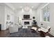 Airy living room with fireplace, comfortable seating, and lots of natural light at 1200 Ponce De Leon Ne Ave # A1, Atlanta, GA 30306