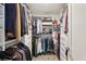 Spacious walk-in closet with custom shelving, multiple hanging rods, and shoe racks at 1200 Ponce De Leon Ne Ave # A1, Atlanta, GA 30306