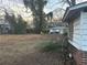 Large backyard with a neighboring home, potential for landscaping, and outdoor enjoyment at 1713 Cahoon St, Atlanta, GA 30310