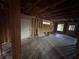 Bedroom featuring exposed beams, a closet, and a window needing remodeling at 1713 Cahoon St, Atlanta, GA 30310