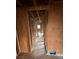 Hallway featuring exposed framing, hardwood floors and an air vent awaiting remodeling at 1713 Cahoon St, Atlanta, GA 30310