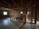 Spacious living room featuring exposed framing, windows, and hardwood floors awaiting remodeling at 1713 Cahoon St, Atlanta, GA 30310
