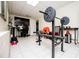 Basement home gym featuring weightlifting equipment and a TV for entertainment at 52 Newman Dr, Villa Rica, GA 30180