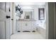 Elegant bathroom featuring a vanity with modern fixtures, soaking tub, and a clean, contemporary design at 52 Newman Dr, Villa Rica, GA 30180