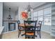 Bright dining nook with an elegant light fixture, adjacent to staircase and big windows at 52 Newman Dr, Villa Rica, GA 30180