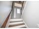 Bright, welcoming foyer with a decorative front door and neutral paint at 52 Newman Dr, Villa Rica, GA 30180
