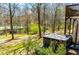 Backyard hot tub nestled amidst greenery, offering a private and relaxing outdoor experience at 52 Newman Dr, Villa Rica, GA 30180