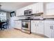 Well-lit kitchen with white cabinetry, stainless steel appliances, and a functional layout for everyday meals at 52 Newman Dr, Villa Rica, GA 30180