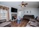 Inviting living room with stone fireplace, modern lighting, and comfortable, cozy seating arrangement at 52 Newman Dr, Villa Rica, GA 30180