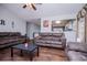 Bright living area with hardwood flooring, neutral paint, and a passthrough to the kitchen at 52 Newman Dr, Villa Rica, GA 30180