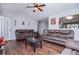 Comfortable living space featuring hardwood floors, a view of the kitchen, and neutral wall color at 52 Newman Dr, Villa Rica, GA 30180