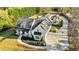 An aerial view of the house with an elongated driveway leading to backyard entertainment at 5241 Moon Rd, Powder Springs, GA 30127
