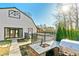 Backyard with outdoor kitchen and modern barn house, combining outdoor living with a distinct architectural flair at 5241 Moon Rd, Powder Springs, GA 30127