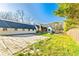 Large backyard with tennis area and partial view of the home's architecture at 5241 Moon Rd, Powder Springs, GA 30127