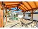 Backyard featuring a covered patio and swimming pool, perfect for outdoor entertaining at 5241 Moon Rd, Powder Springs, GA 30127