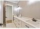 Modern bathroom featuring double vanity sinks with white cabinetry, and access to the walk-in shower at 5241 Moon Rd, Powder Springs, GA 30127