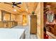 Bright bedroom featuring natural wood walls, ceiling, and an open closet space at 5241 Moon Rd, Powder Springs, GA 30127
