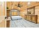 Spacious bedroom featuring wood-paneled walls and ceiling plus handsome furniture at 5241 Moon Rd, Powder Springs, GA 30127