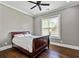 Cozy bedroom with wood floors, ceiling fan, and lots of natural light at 5241 Moon Rd, Powder Springs, GA 30127