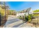 Long, modern driveway leads to a barn style home with mature landscaping at 5241 Moon Rd, Powder Springs, GA 30127