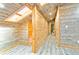 Hallway with sloped ceiling featuring grey wood-paneled walls and wood frame at 5241 Moon Rd, Powder Springs, GA 30127