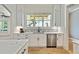 Bright and modern kitchen with white cabinets, stainless steel appliances, and a decorative backsplash at 5241 Moon Rd, Powder Springs, GA 30127