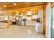 Open concept kitchen with stainless appliances, white cabinets, and granite countertops, creating a modern and efficient workspace at 5241 Moon Rd, Powder Springs, GA 30127