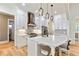 Modern kitchen with white cabinets, stainless steel appliances, and a large island at 5241 Moon Rd, Powder Springs, GA 30127