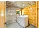 Laundry room features new washer and dryer and wood walls at 5241 Moon Rd, Powder Springs, GA 30127