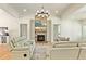 Cozy living room featuring a stone fireplace and plush, comfortable seating at 5241 Moon Rd, Powder Springs, GA 30127