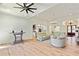 Open living room with hardwood floors, high ceilings, and a view into the kitchen at 5241 Moon Rd, Powder Springs, GA 30127