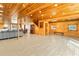 Open floor plan includes a large living space, wood walls, dining area, and kitchen at 5241 Moon Rd, Powder Springs, GA 30127