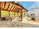 Outdoor kitchen featuring a wood-burning fireplace and a stone bar, providing a luxurious entertaining space at 5241 Moon Rd, Powder Springs, GA 30127