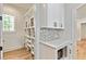 Convenient pantry with custom shelving, ample storage, and built-in microwave at 5241 Moon Rd, Powder Springs, GA 30127