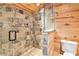 Elegant shower stall featuring stone tiles and glass door at 5241 Moon Rd, Powder Springs, GA 30127