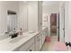 Bright bathroom featuring a double sink vanity with tile flooring at 6040 Boulder Bluff Dr, Cumming, GA 30040