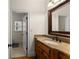 Bathroom with granite countertops and wooden cabinetry at 6040 Boulder Bluff Dr, Cumming, GA 30040