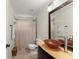 Well-lit bathroom featuring a stylish vessel sink, shower, and neutral wall paint at 6040 Boulder Bluff Dr, Cumming, GA 30040