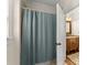 Bathroom with blue shower curtain at 6040 Boulder Bluff Dr, Cumming, GA 30040