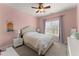 Comfortable bedroom featuring carpet flooring, a ceiling fan and window at 6040 Boulder Bluff Dr, Cumming, GA 30040