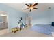 Bedroom featuring light blue walls, neutral carpet and ceiling fan at 6040 Boulder Bluff Dr, Cumming, GA 30040