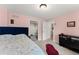 Comfortable bedroom with soft carpet, and easy access to the office and hallway at 6040 Boulder Bluff Dr, Cumming, GA 30040