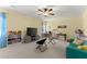 Large bonus room featuring toys, TV, couch and large window at 6040 Boulder Bluff Dr, Cumming, GA 30040