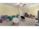 Large bonus room featuring toys, TV, couch and neutral carpet at 6040 Boulder Bluff Dr, Cumming, GA 30040