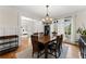 Charming dining room with hardwood floors, neutral walls, large windows, and views into the office at 6040 Boulder Bluff Dr, Cumming, GA 30040